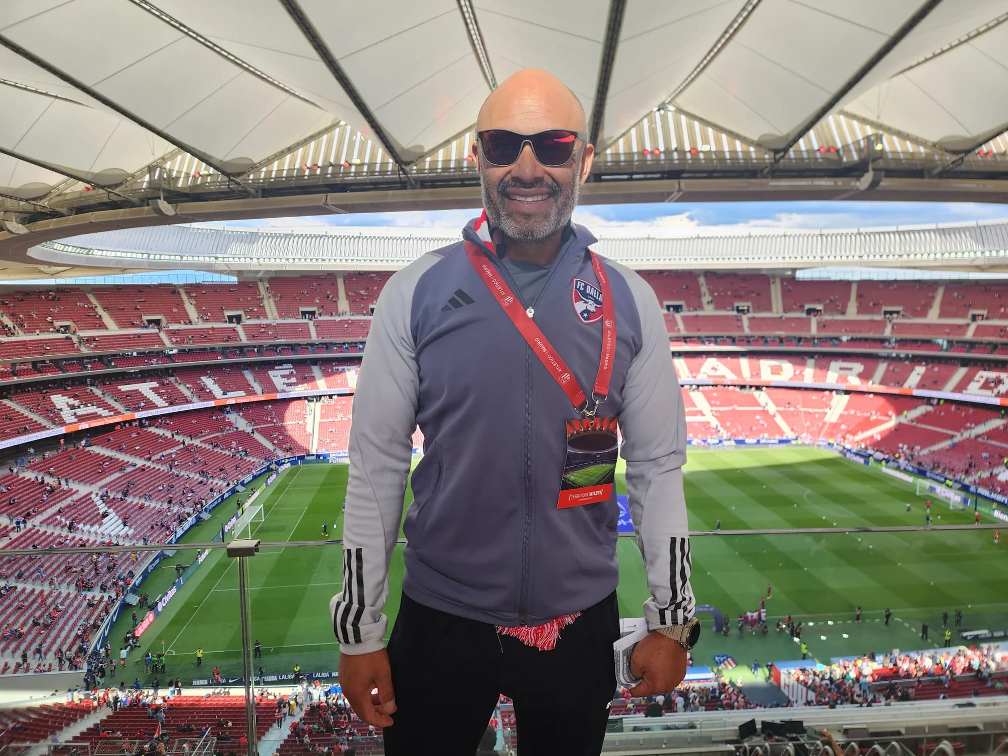 Alberto Carbajal overlooking the pitch from stadium seating during the Spain team trip