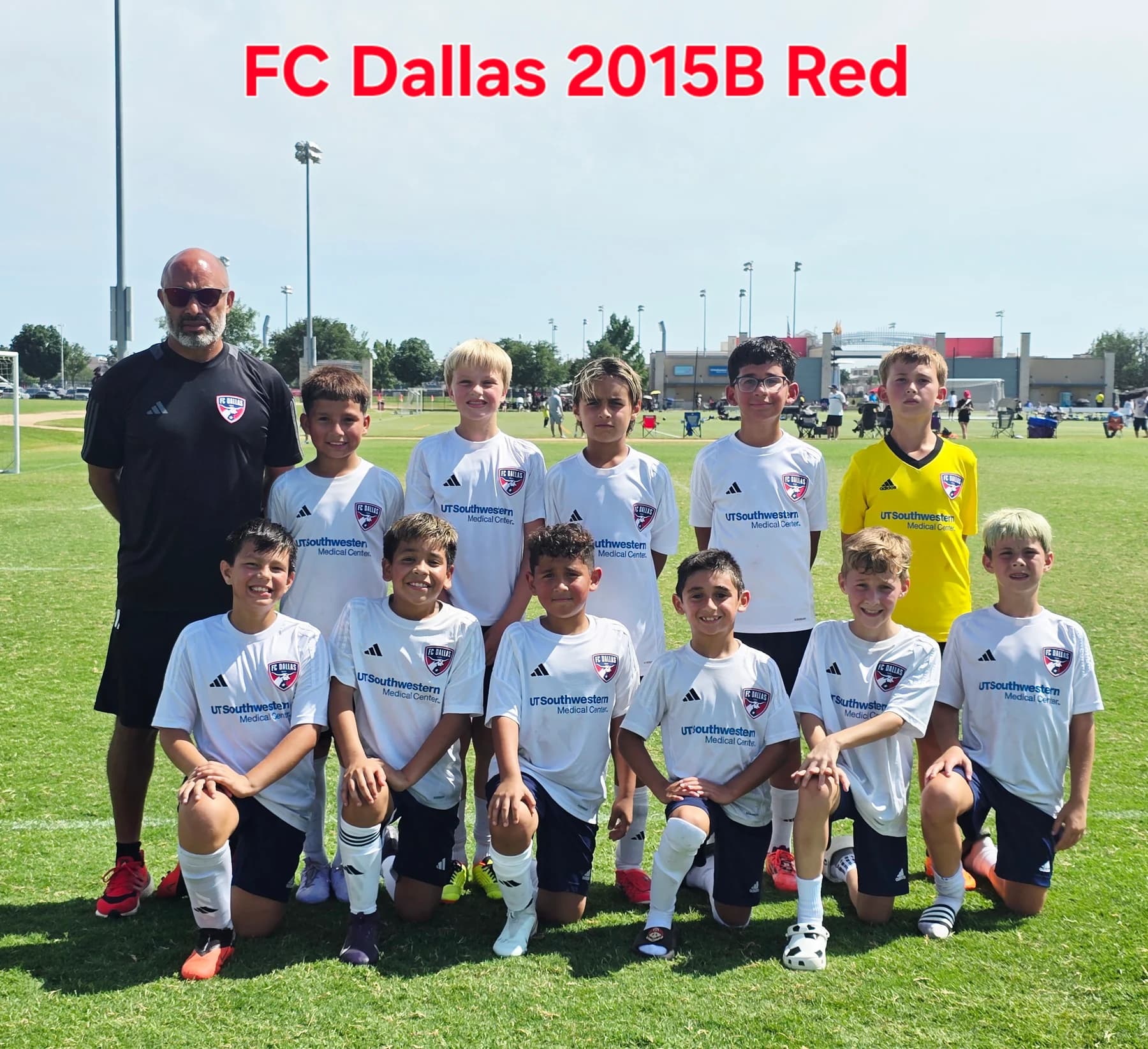 Alberto Carbajal and his FC Dallas 2015 Boys Red team posing on the pitch